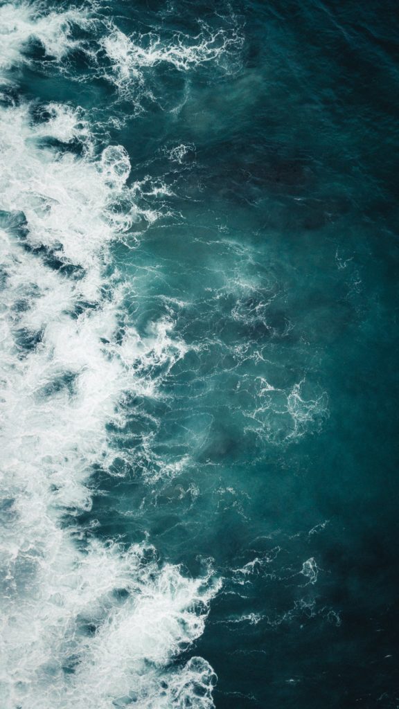 Aerial view of a turquoise wave