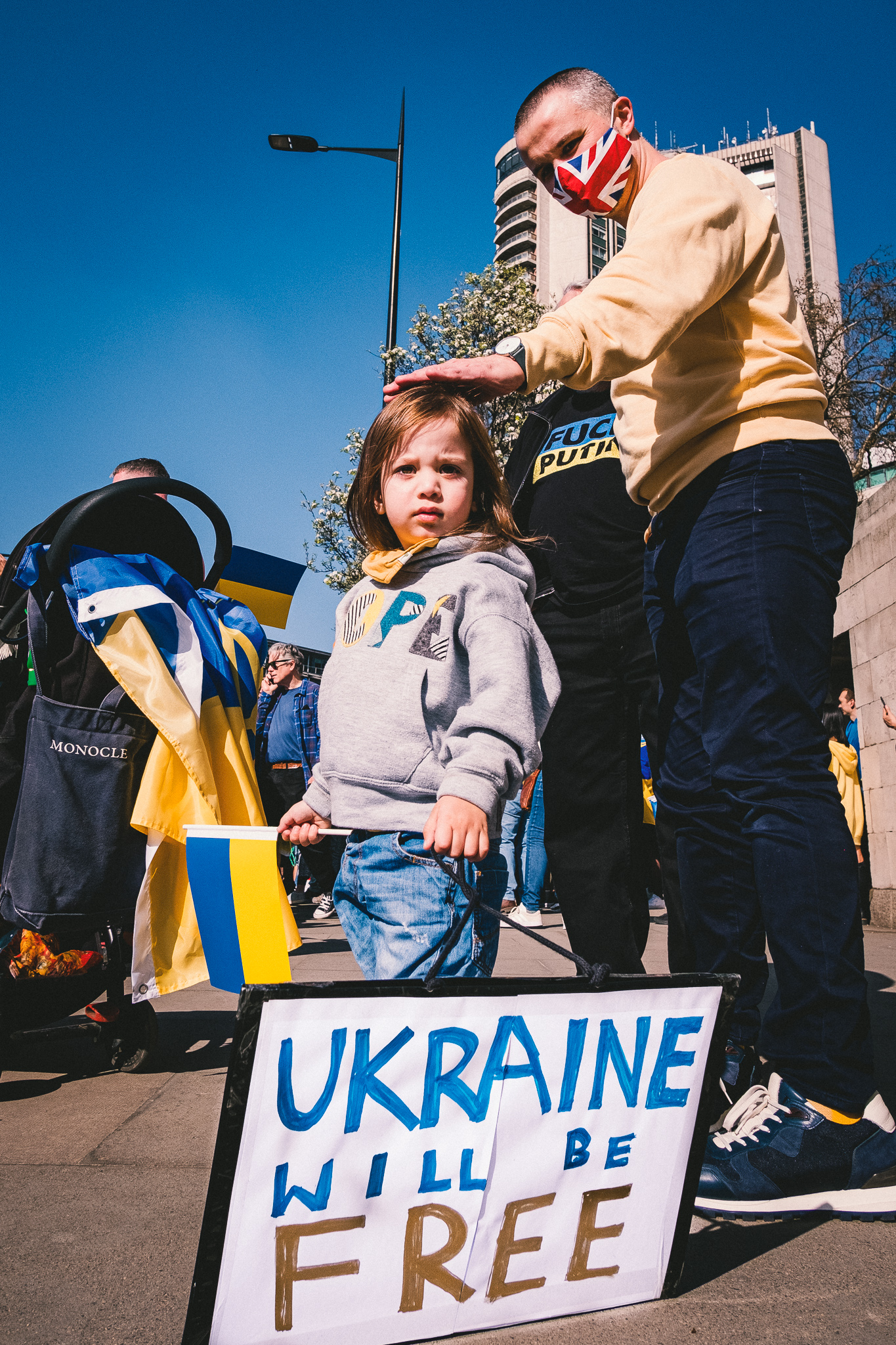 Father and a child at the march of solidarity with Ukraine