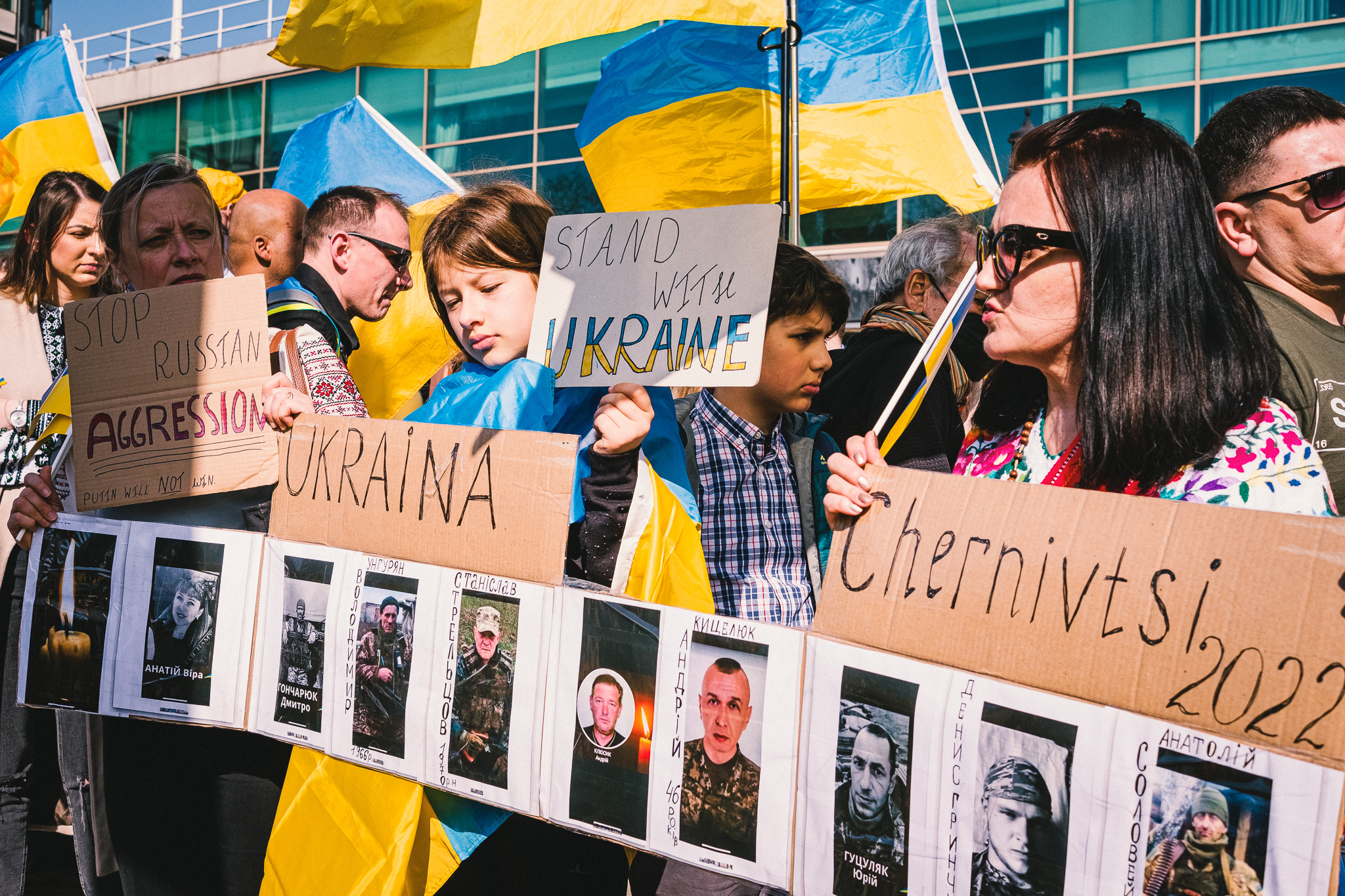 A group of protesters holding banners at solidarity march with Ukraine in London on the 26th of March 2022