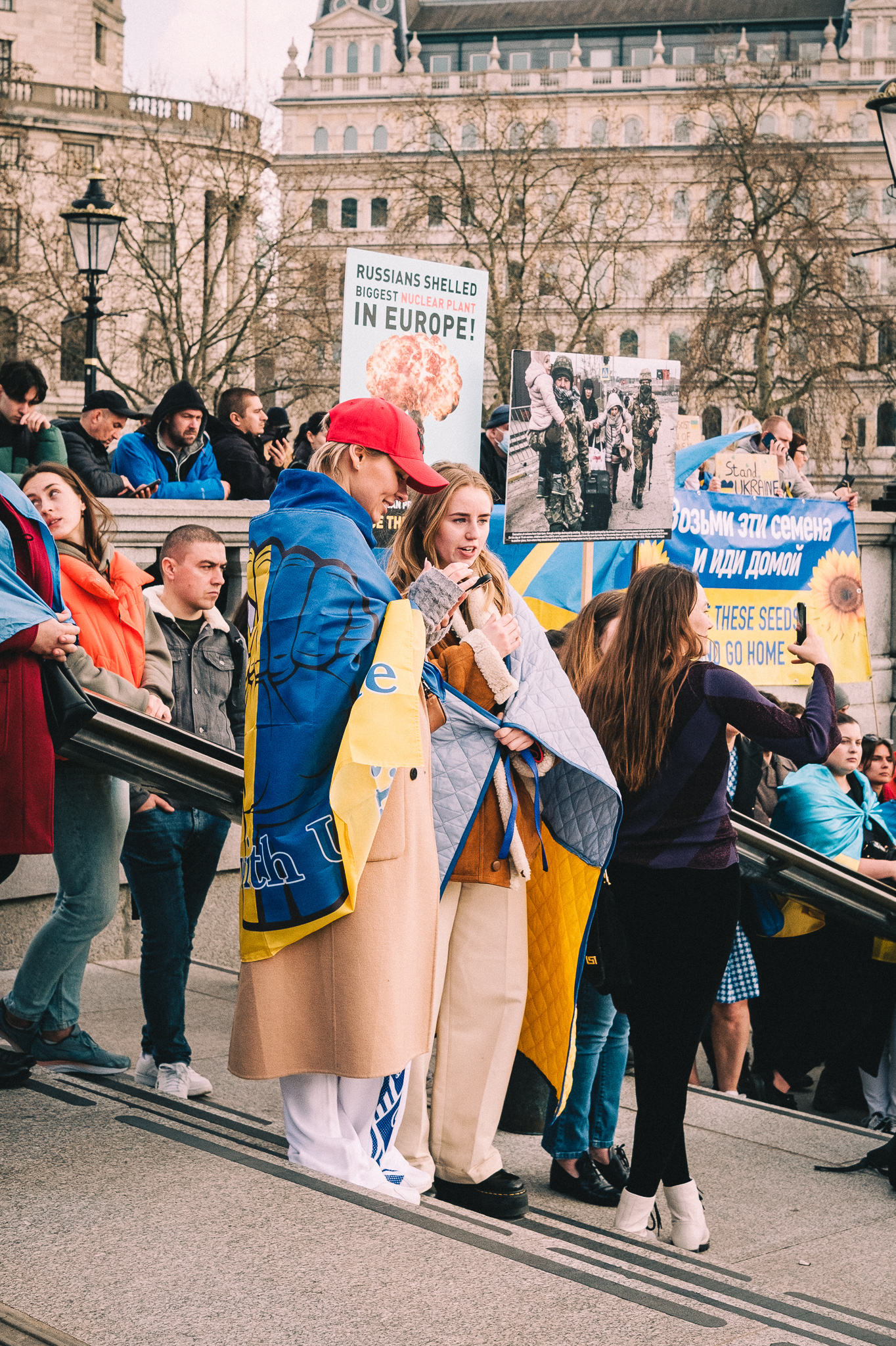 A group of protesters at the rally to support Ukraine at Trafalgar Square on the steps of the National Gallery