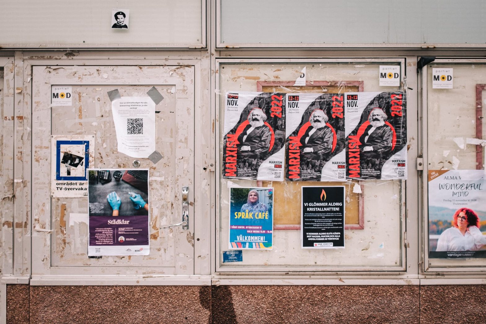 Ripped posters on a wall in Örnsköldsvik
