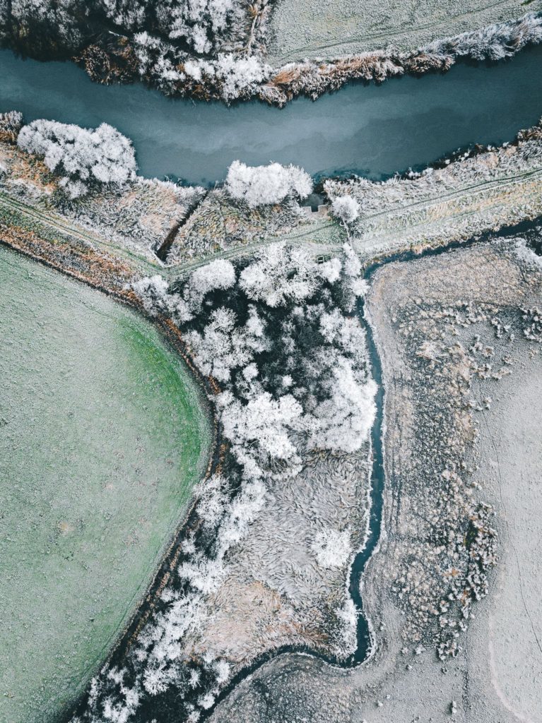 Top down areal view of wetlands on a cold frosty morning